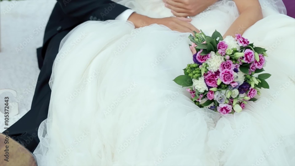 Close up of Grooms Hand Gently Stroking Hand of the Bride Close up of Grooms Hand Gently Stroking Hand of the Bride