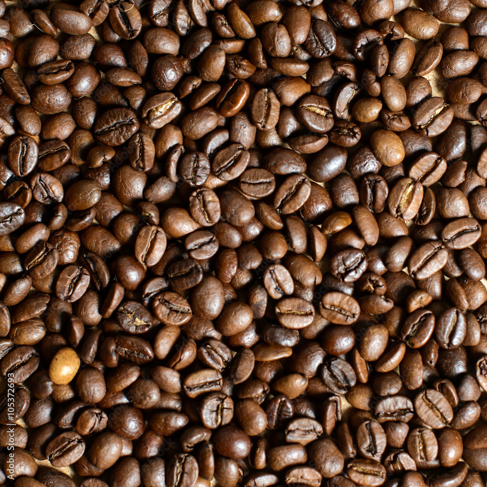 Roasted brown coffee beans, can be used as a background and texture Roasted brown coffee beans, can be used as a background and texture