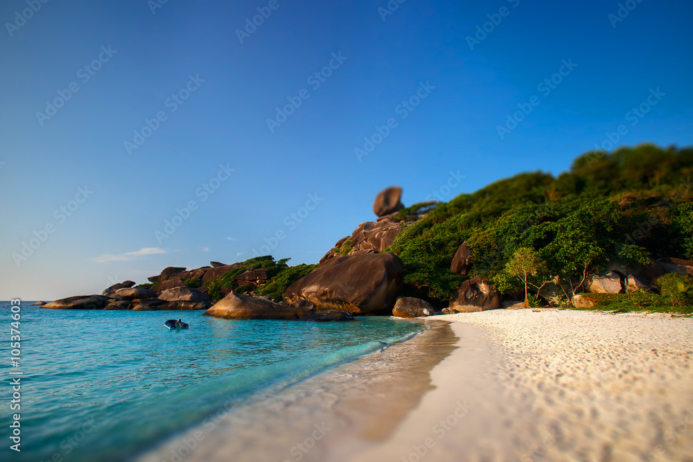beautiful beach on tropical island with clear turquoise water