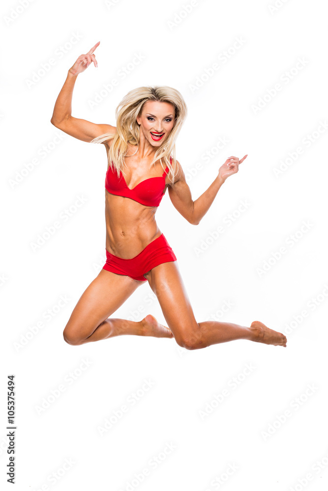 beautiful girl in a bathing suit jumped on a white background beautiful girl in a bathing suit jumped on a white background