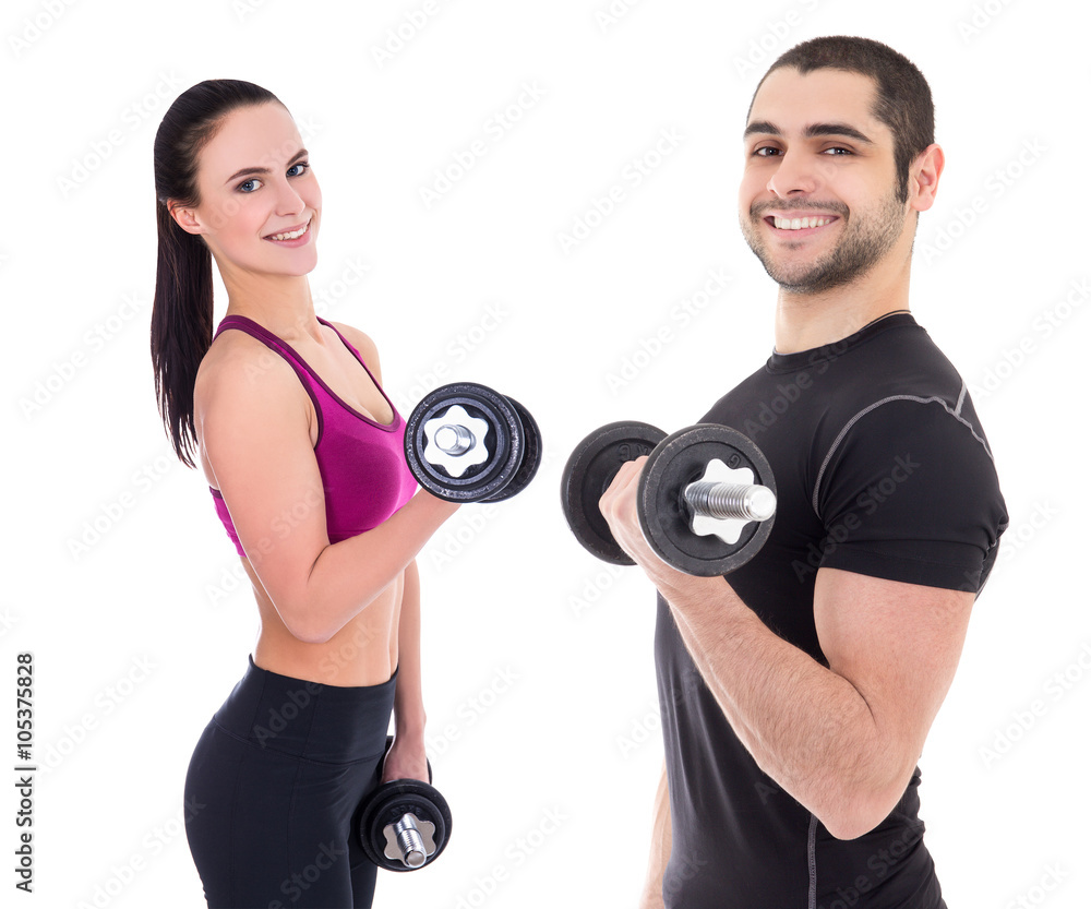happy couple in sportswear doing exercises with dumbbells isolat happy couple in sportswear doing exercises with dumbbells isolat