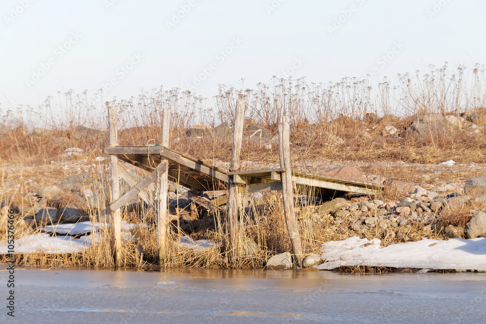Two small rural wooden bridges and ice