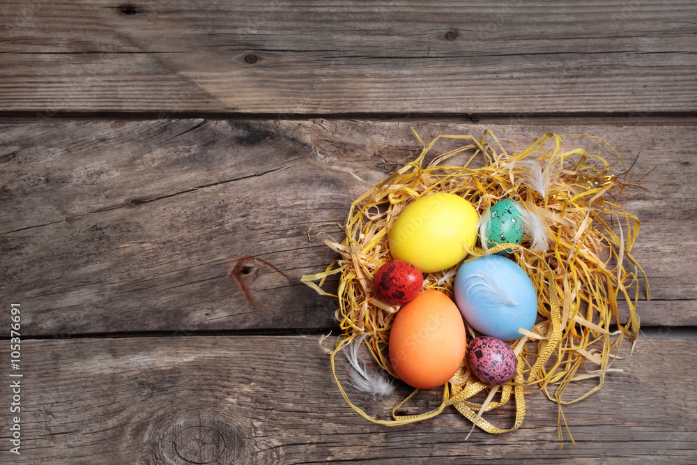 Easter color eggs on old wooden table