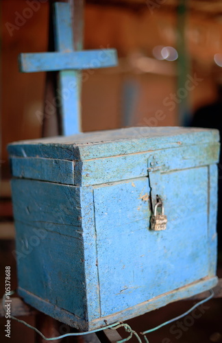 Christian donation box painted blue. Tavern in Afrera-Ethiopia. 0179