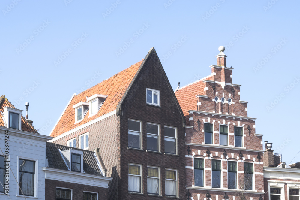 Fototapeta premium Vintage roofs of the buildings in the old district of Delfshaven in Rotterdam, Netherlands.