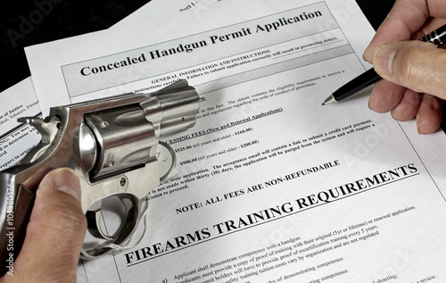 Man with pistol and handgun permit application