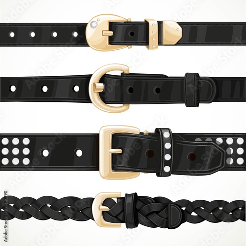 Set of black buttoned to buckle belts isolated on white backgrou photo
