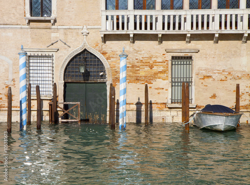 High tide in Venice fllooding antique palace on Grand Canal photo