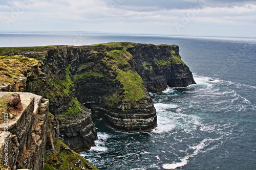 Cliffs of Moher at Hags Head where the Atlantic ocean and Liscanor Bay meet photo