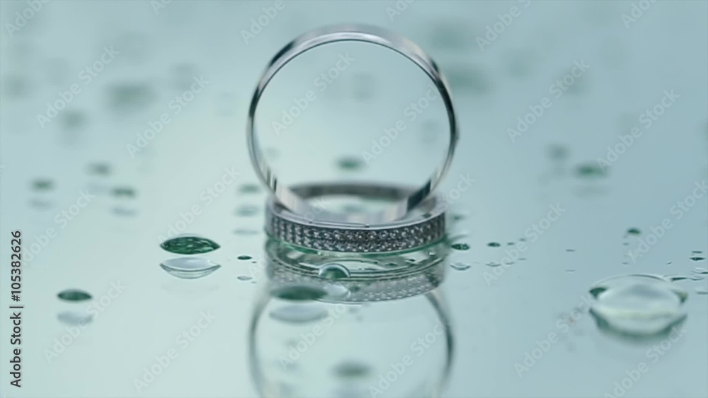 Reflection of beautiful Wedding Rings on the Glass in Rainy weather Reflection of beautiful Wedding Rings on the Glass in Rainy weather