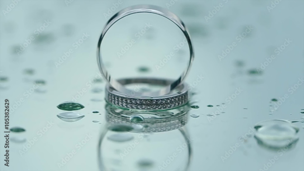 Reflection of beautiful Wedding Rings on the Glass in Rainy weather Reflection of beautiful Wedding Rings on the Glass in Rainy weather