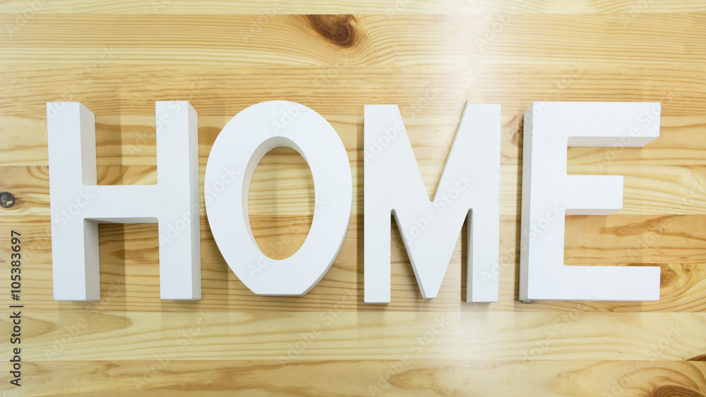 The word Home on the wooden background The word Home on the wooden background