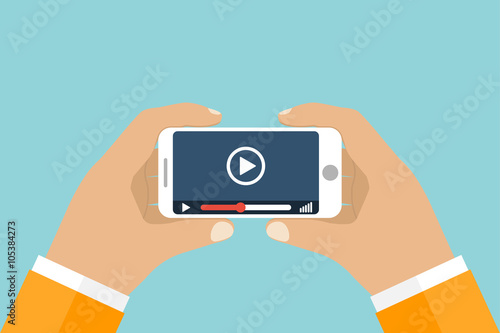 Hand holds smartphone. Video player application on your mobile p