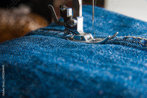 Foot of Sewing Machine on Jeans