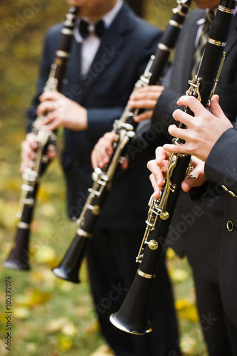group of musicians playing the clarinet.
