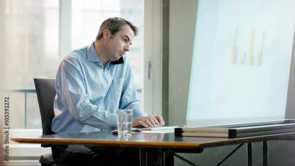 business man at office desk making a phone call business man at office desk making a phone call
