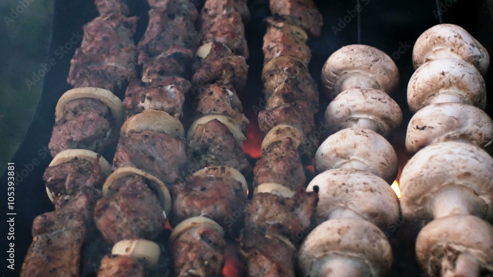 meat and mushrooms roasted on the fire skewers meat and mushrooms roasted on the fire skewers