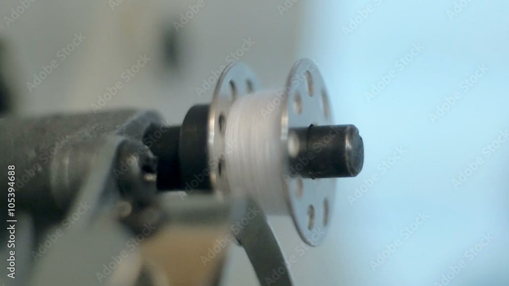 Sewing machine - spinning a bobbin Sewing machine - spinning a bobbin