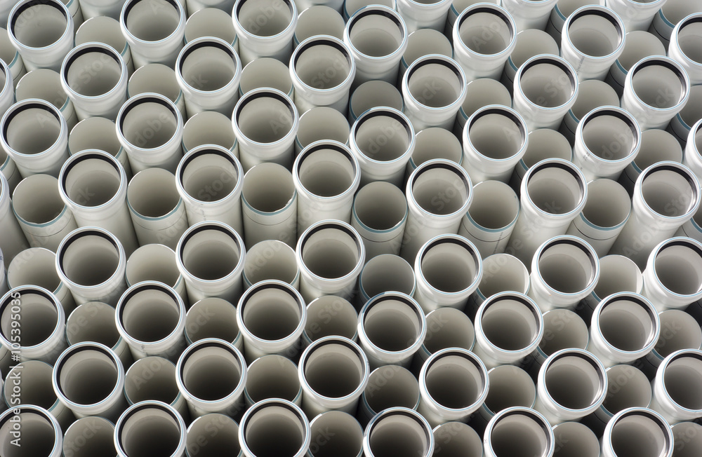 white plastic PVC pipes stacked white plastic PVC pipes stacked