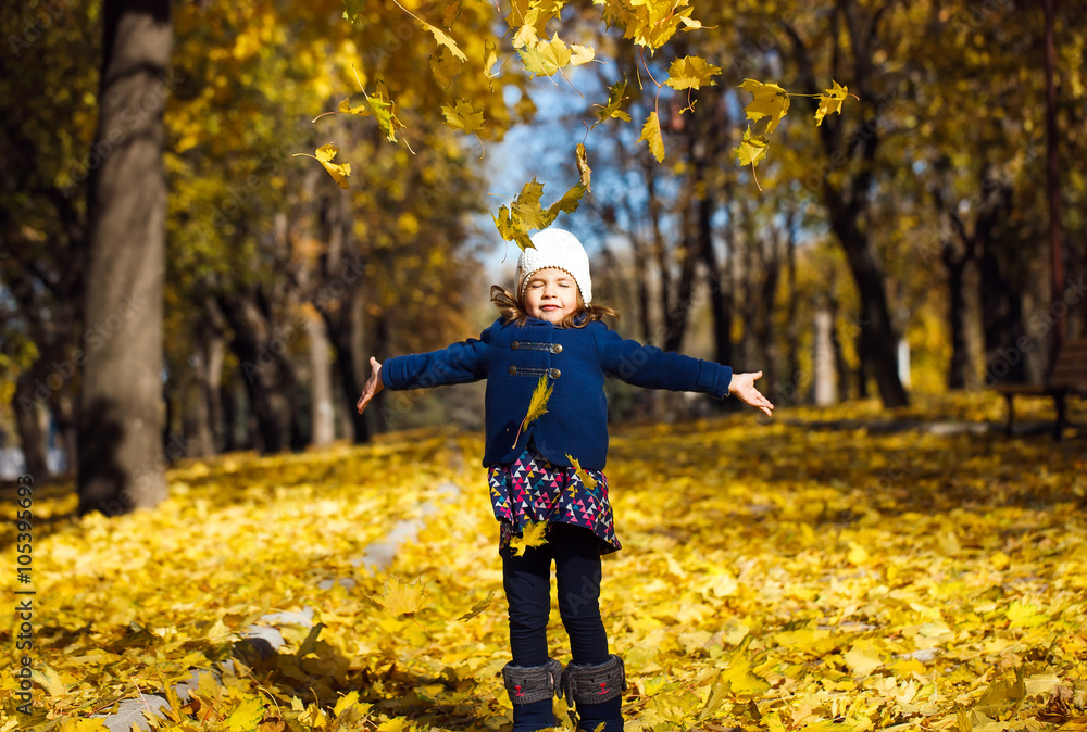 little girl throwing autumn leaves little girl throwing autumn leaves
