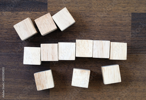 Wooden cubes on wood background