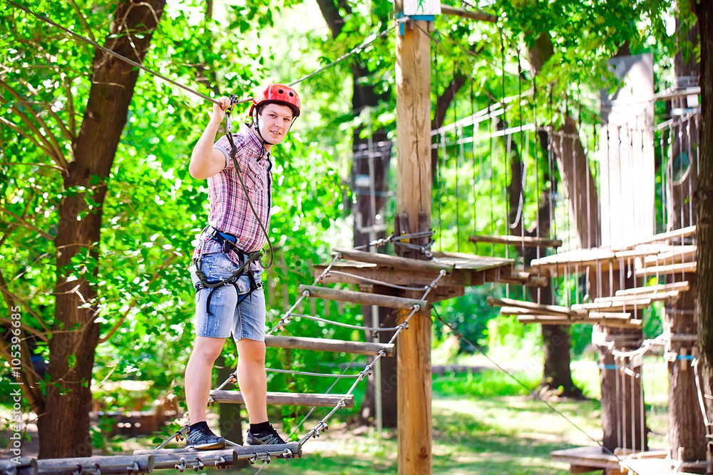 adventure climbing high wire park - people on course in mountain