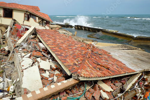 Erosion, climate change, broken building, Hoi An, Vietnam photo