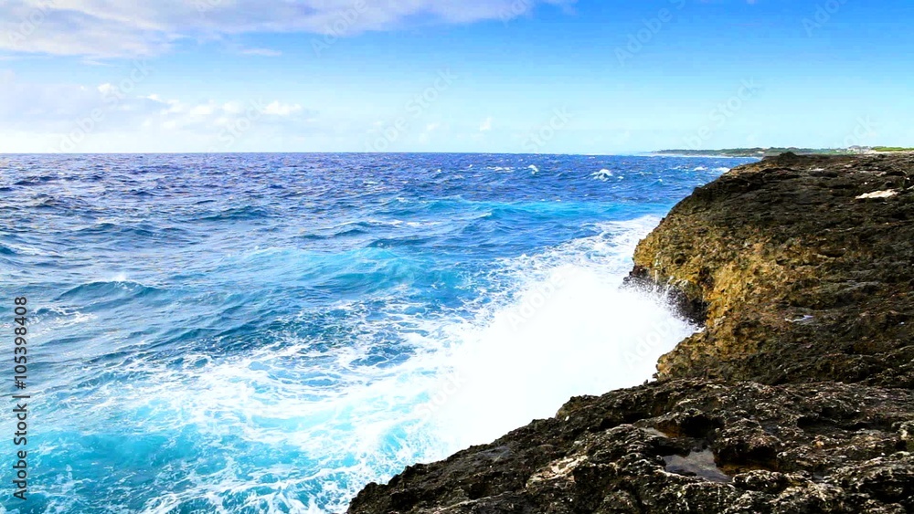 Tropical ocean's waves breaking on the reef shore Tropical ocean's waves breaking on the reef shore