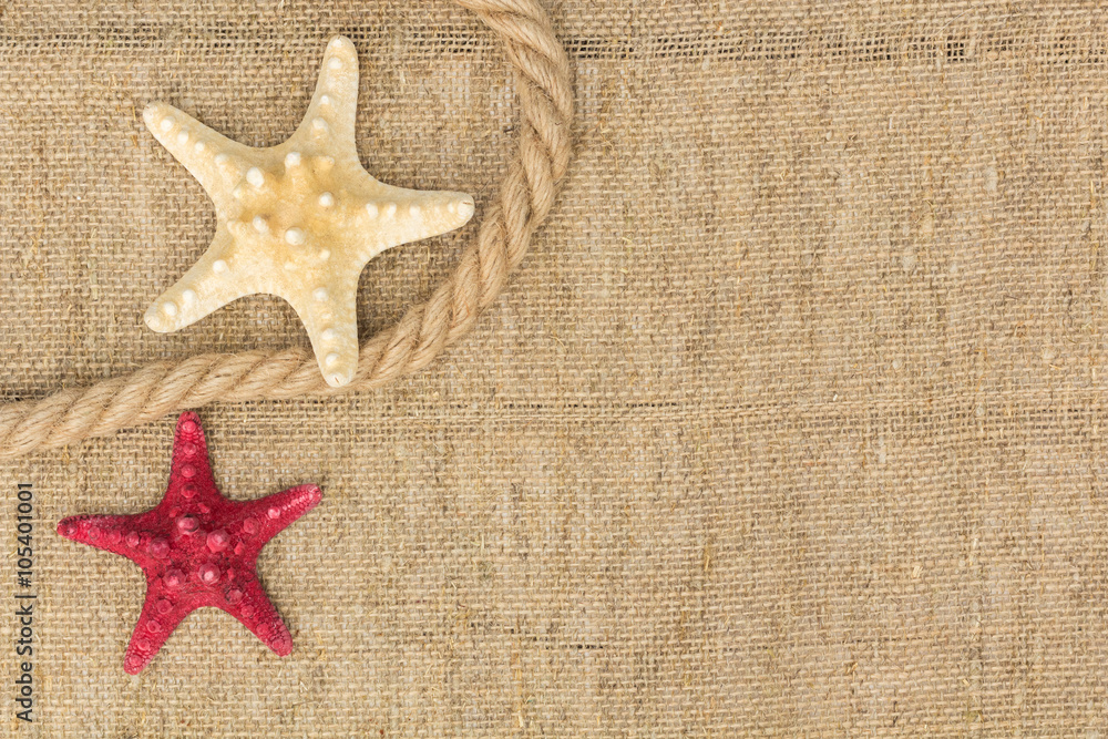 starfish and rope lying on a sackcloth starfish and rope lying on a sackcloth
