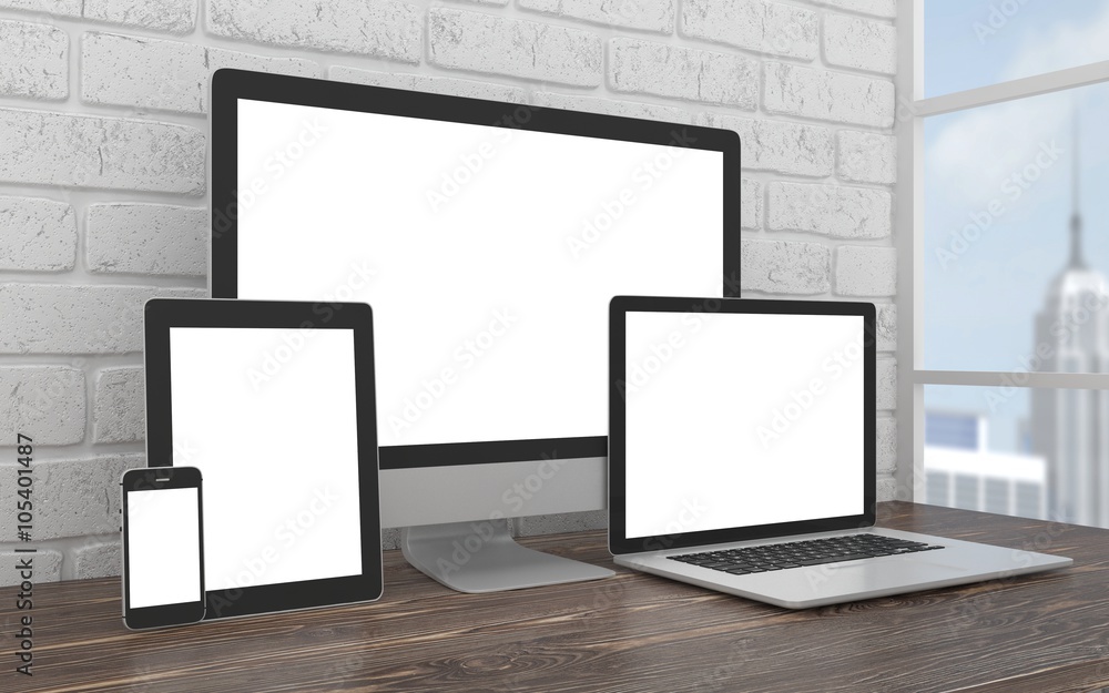 Fototapeta premium Responsive mockup screen. Monitor, laptop, tablet, phone on table in office.