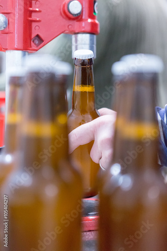 Man holding craft beer bottle