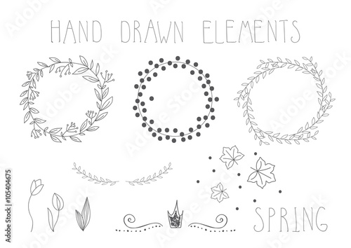 Set of hand drawn frames, wreaths and floral elements. Vector.