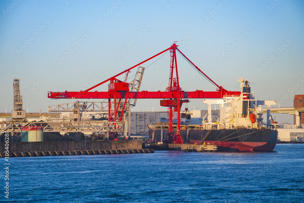 Industrial ship and cranes at port of Osaka