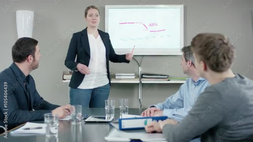 Businesswoman presenting loss at a businessmeeting Businesswoman presenting loss at a businessmeeting