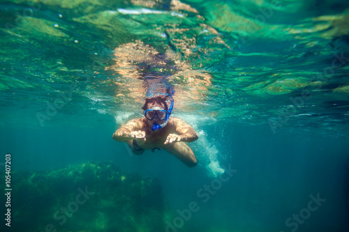 snorkling man swim underwater