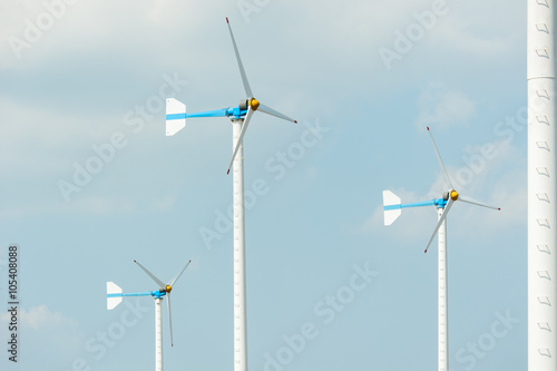 Eco energy - wind turbines ,blue sky background