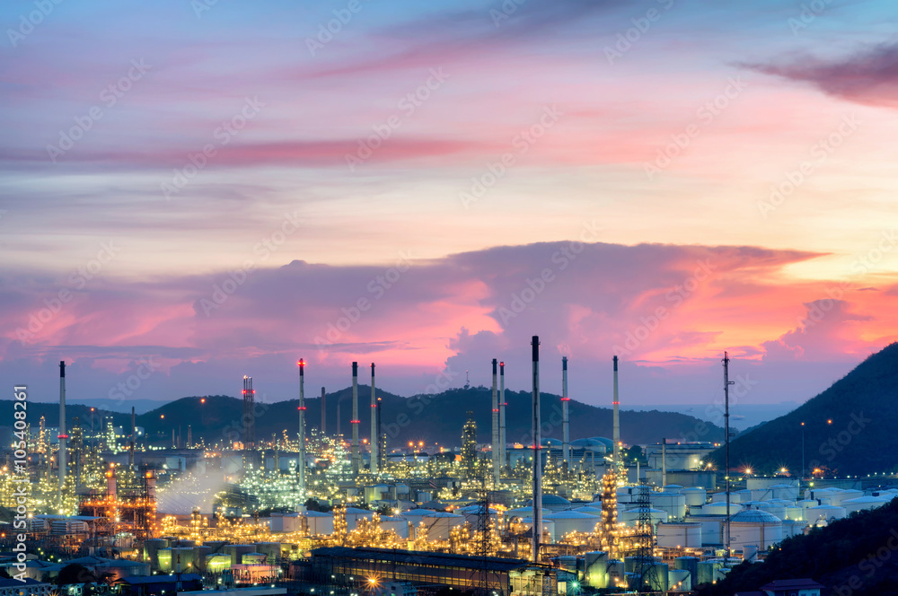 Refinery with tube and oil tank along twilight sky at beautiful