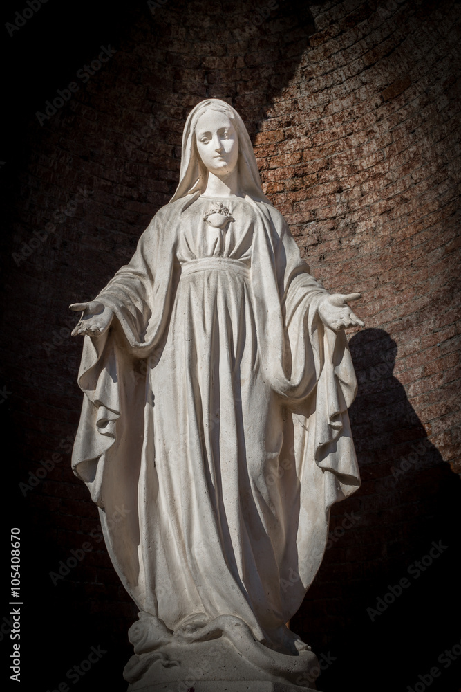 White stone statue of saint Mary