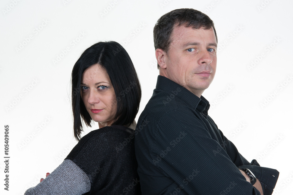 Couple mid aged standing back to back having relationship difficulties. Isolated on white background Couple mid aged standing back to back having relationship difficulties. Isolated on white background