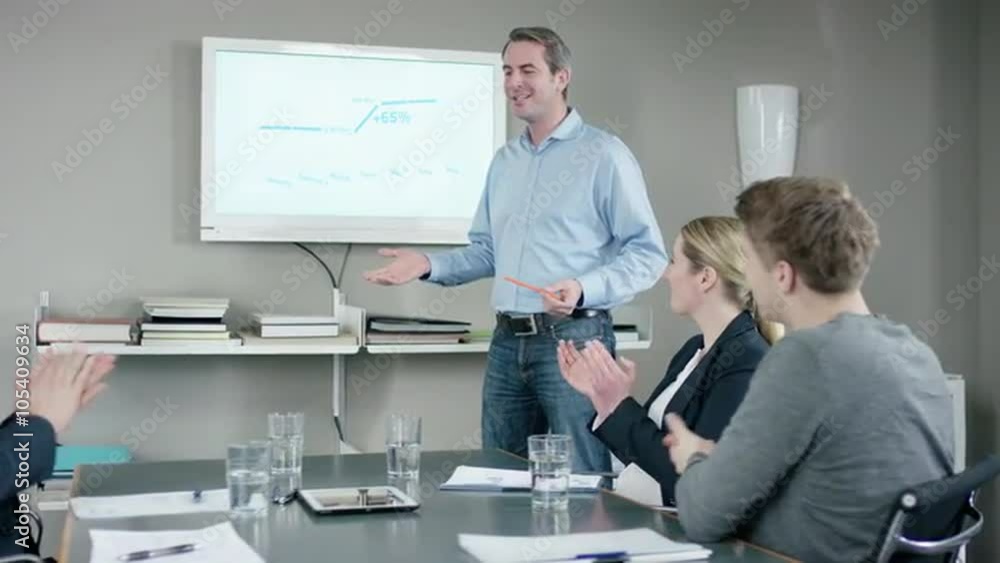 Applause for presenting businessman at businessmeeting Applause for presenting businessman at businessmeeting