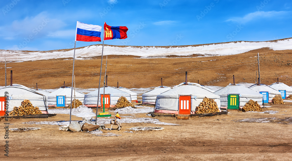 Russian and Mongolian flag next to gers (yurts) Russian and Mongolian flag next to gers (yurts)