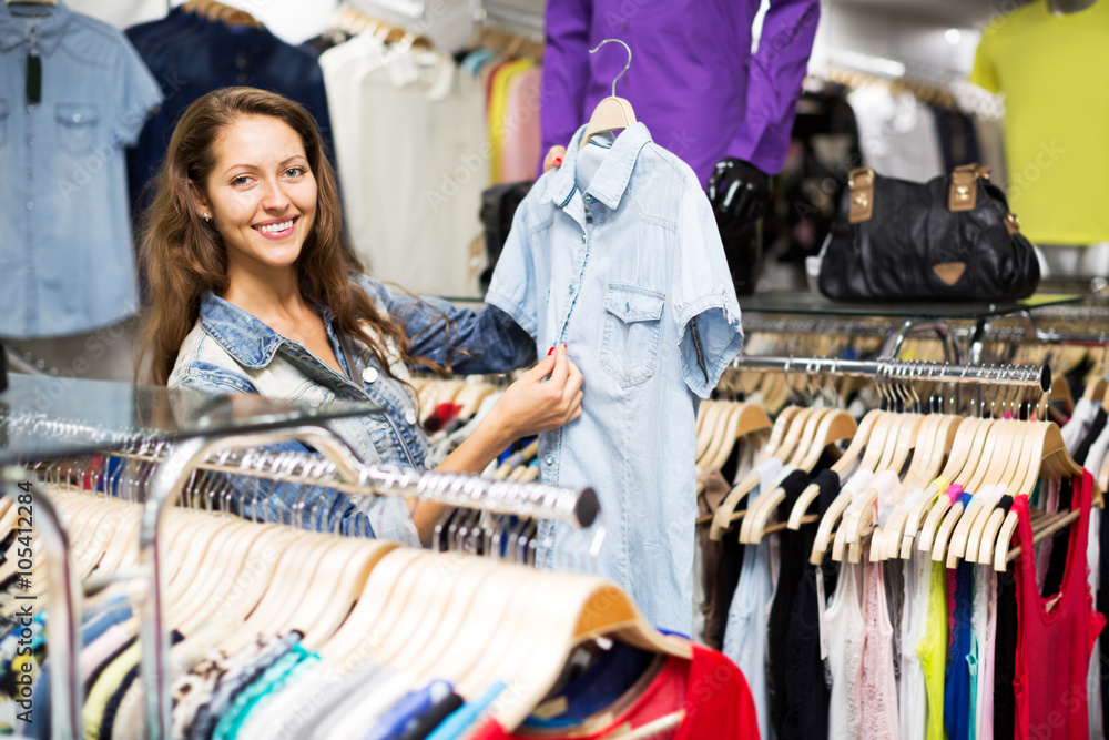 woman buying shirt