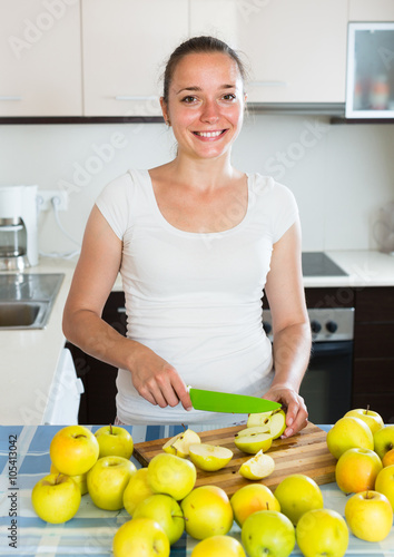 woman cooking dish from apples