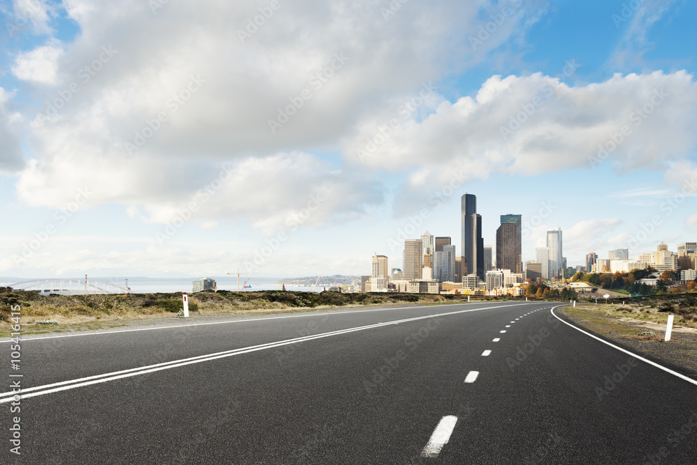road with cityscape and skyline of seattle