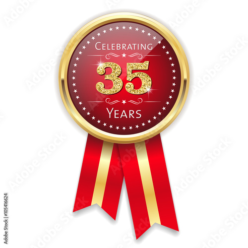 Red celebrating 35 years badge, rosette with gold border and ribbon