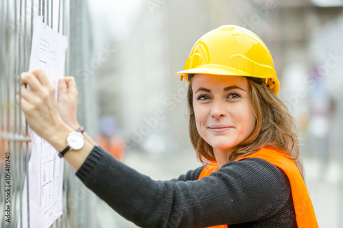 Cute female engineer at work. Outdoors