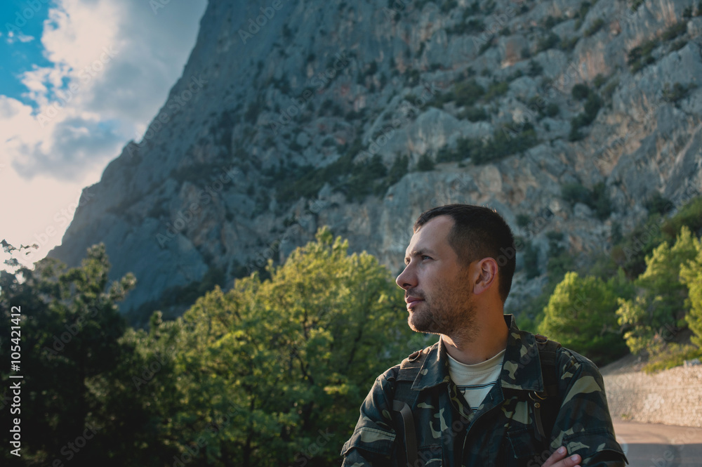 Bearded men dressed camouflage in mountains