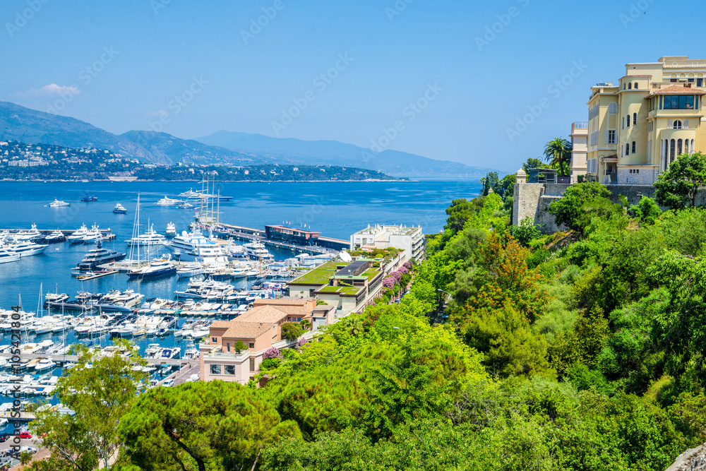 Naklejka premium View of luxury yachts and apartments in harbor of Monaco, Cote d'Azur.