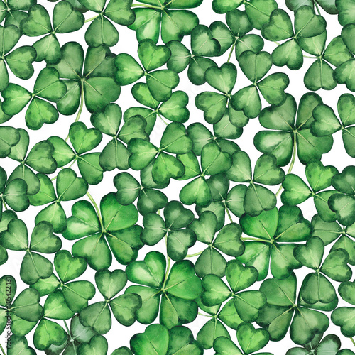 Seamless pattern with green clover trefoil leaves. Hand drawn watercolor background. Original painting.