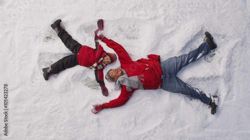 Father and son playing in snow